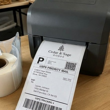 Custom shipping labels printed with a company logo